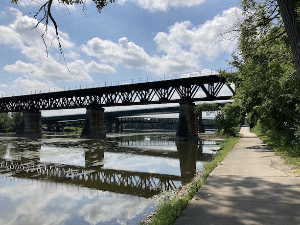 Train and pedestrian bridges crossing the Fox River next to the trail